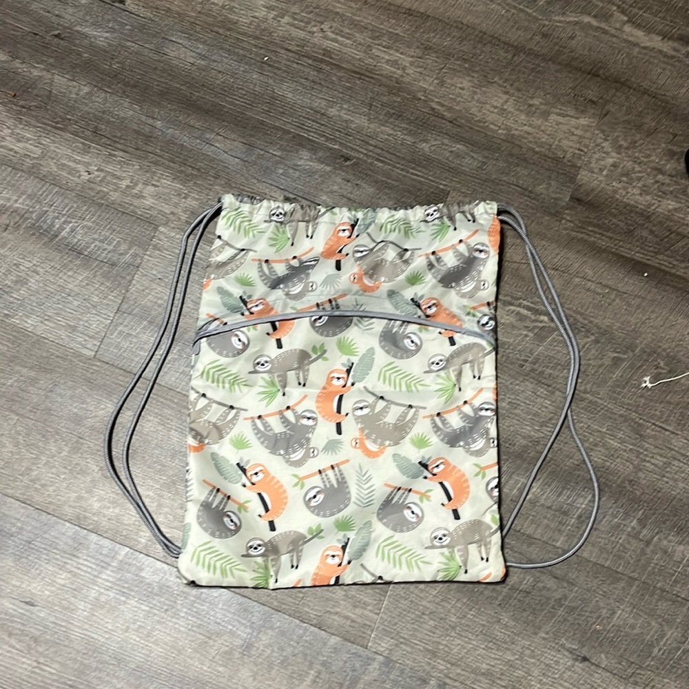 A sloth drawstring bag from thirty one